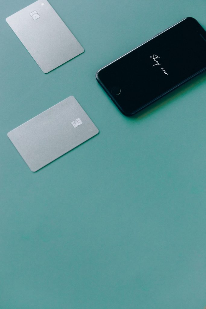 Two bank cards next to a smartphone representing best bank accounts in Germany