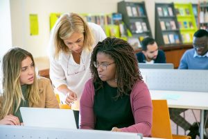 International students studying together in a German university library